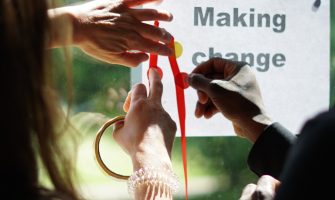 Hands writing making change