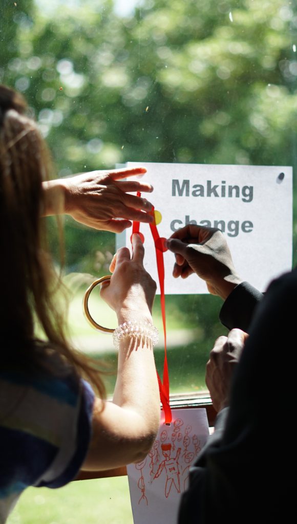 Hands writing making change